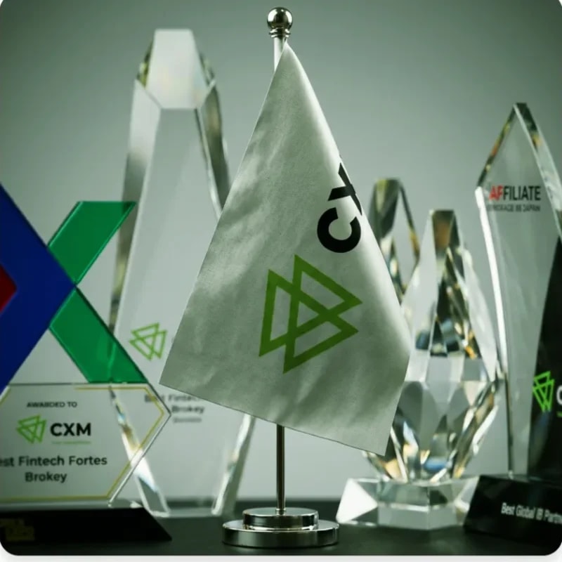 CXM industry award trophies on display